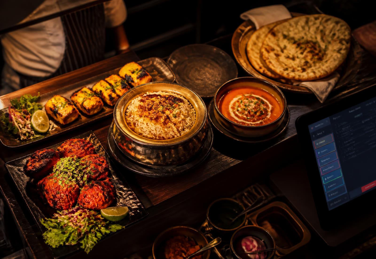 Restaurant pass with tandoori dishes, biryani and a POS tablet